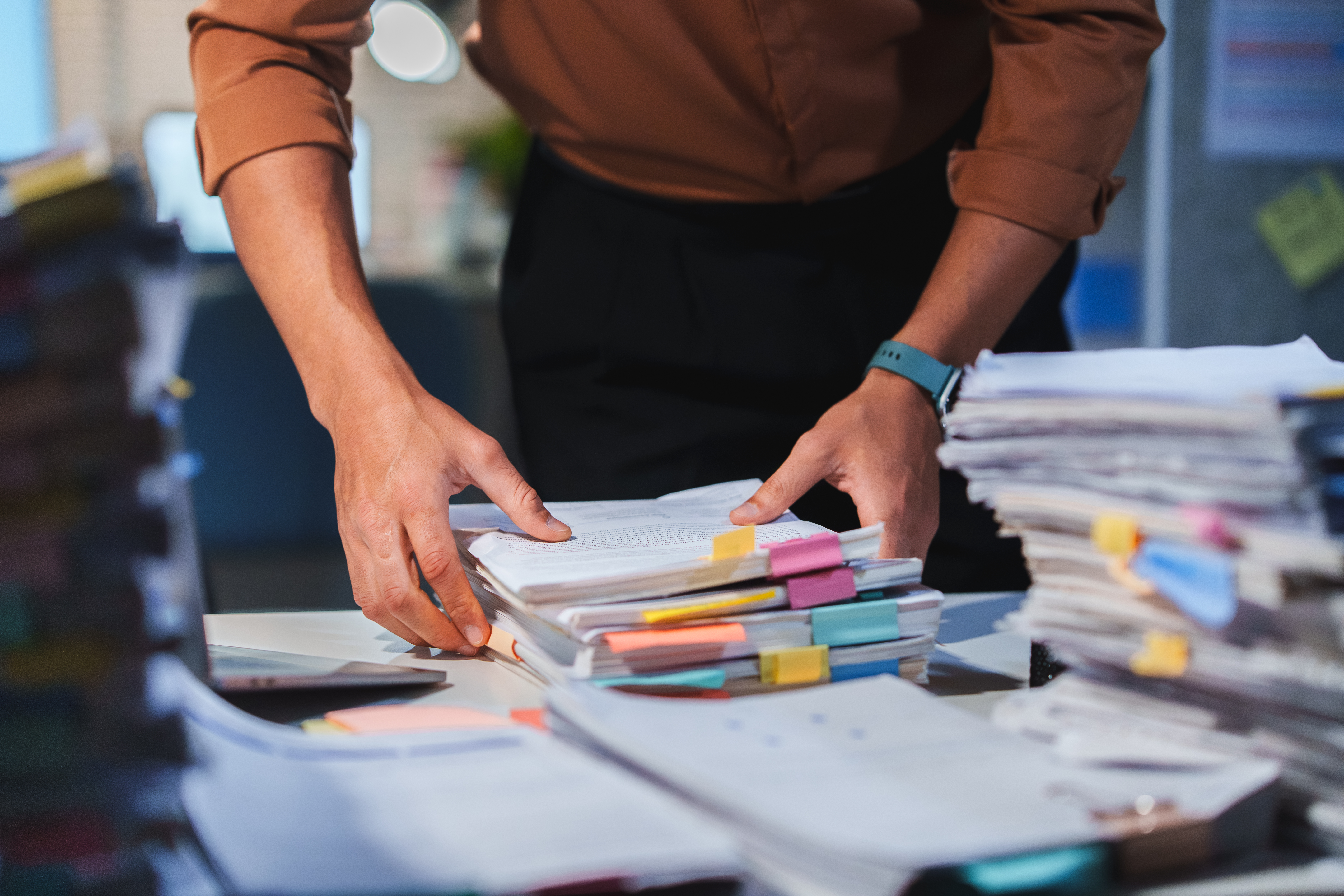 Accountant Organizing Paperwork for Tax Preparation before the Deadline, managing every Document and Management task for Business Finance and Professional Accounting.